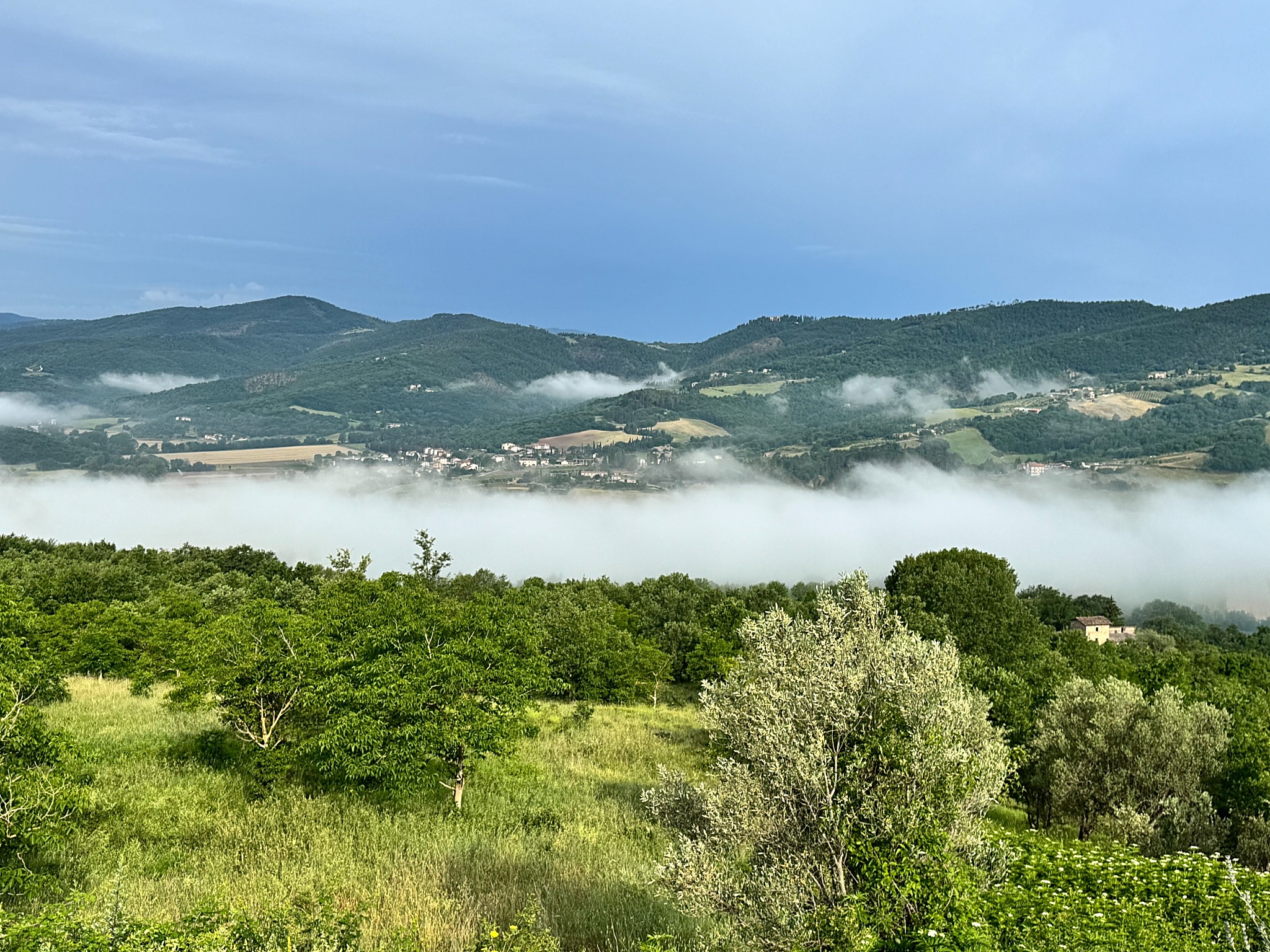 Clouds drifting across the green Niccone Valley in Umbria