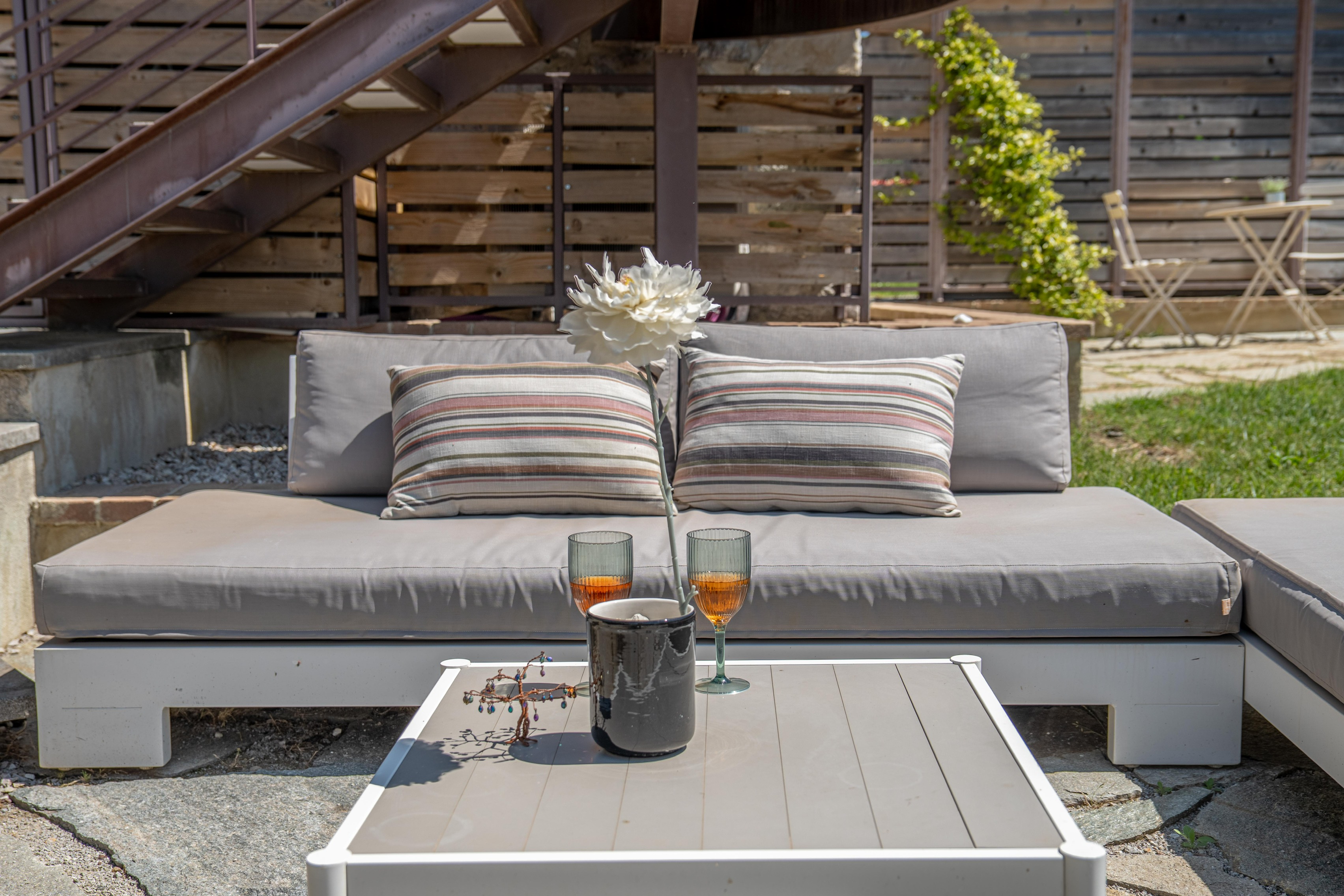 Garden daybed with aperitivo at sunset